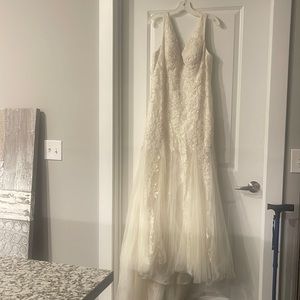 Wedding dress for sale. Size 14. Train is dirty because I wore it in the rain.